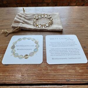 NWT Brett Lauren crystal bracelet with cards and bag.